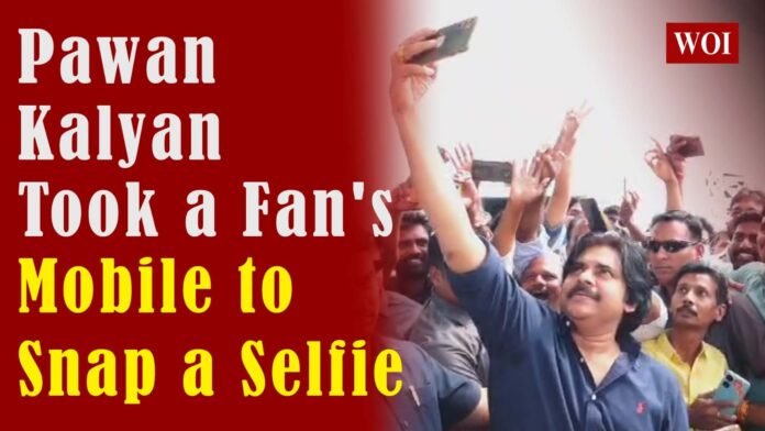 Condensed DescriptionPawan Kalyan pausing for a fan to retrieve a dropped phone, showcasing his patience and humble nature.